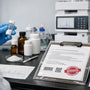 Lab technician holds a sample vial