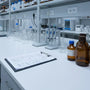 Laboratory workstation with tianeptine research equipment and documentation.