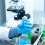 Researcher holding laboratory flask