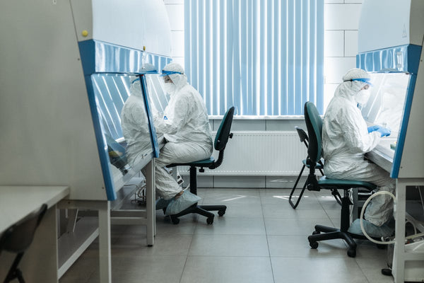 Researchers doing an experiment in the lab