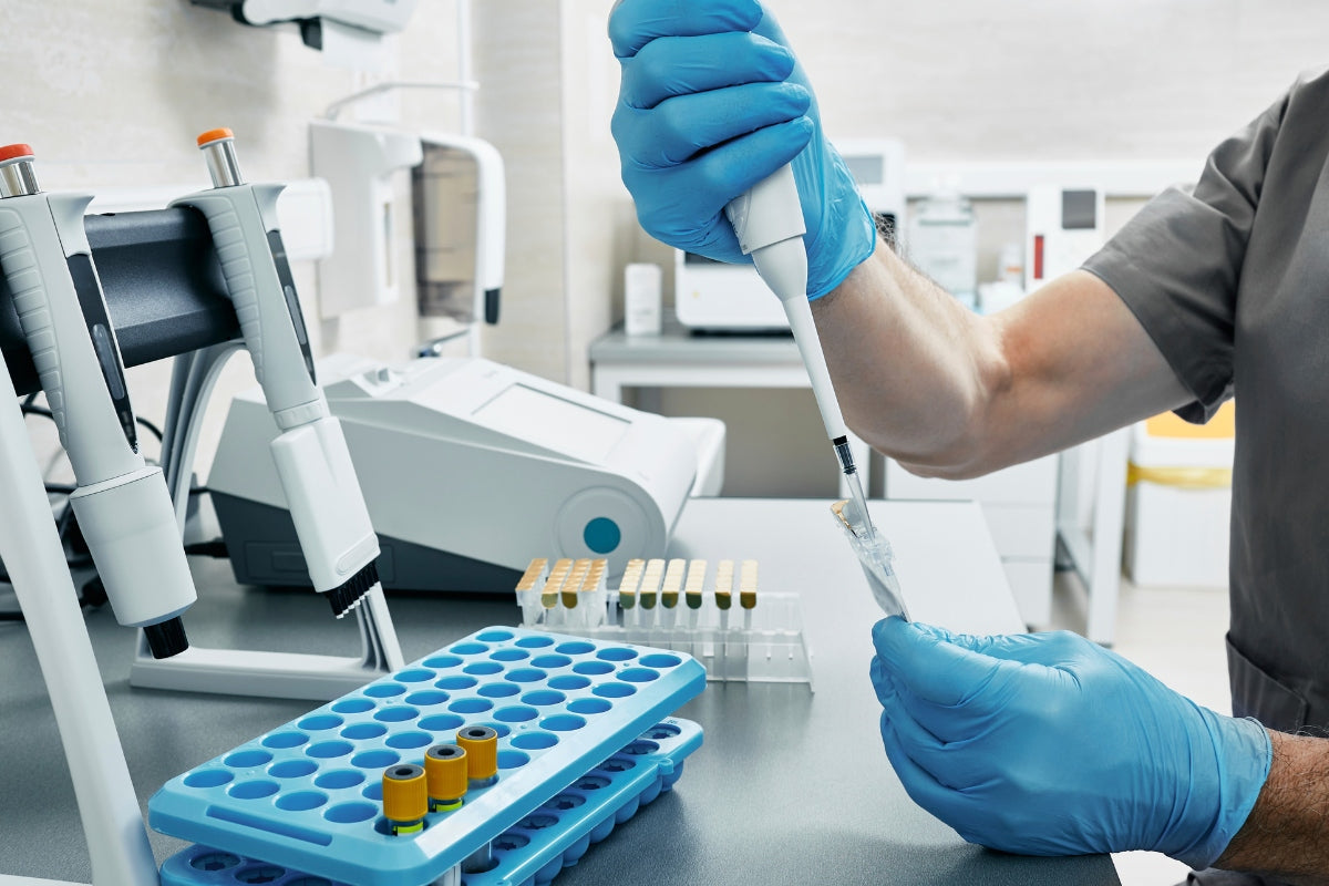 Scientist in a laboratory analyzing a sample related to Phenibut research.