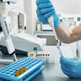 Scientist in a laboratory analyzing a sample related to Phenibut research.