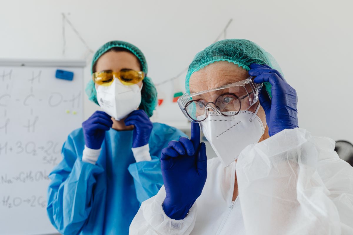 Workers wearing PPE handling phenibut safely
