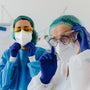 Workers wearing PPE handling phenibut safely