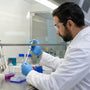 Researcher in gloves, goggles, and lab coat following Agomelatine PPE requirements