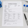 Phenibut Certificate of Analysis printed on a laboratory bench