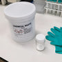 Labeled chemical waste container for Phenibut disposal in a research laboratory