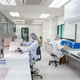 Analytical balance weighing research compound in laboratory