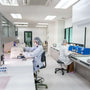 Analytical balance weighing research compound in laboratory