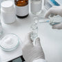 Researcher preparing pramiracetam solution at laboratory workstation