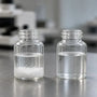 Aniracetam powder undissolved in water beside a clear solution
