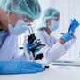 Two people working in a laboratory conducting research