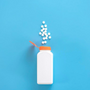 a white bottle containing research compound