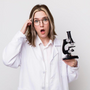 a researcher holding a microscope