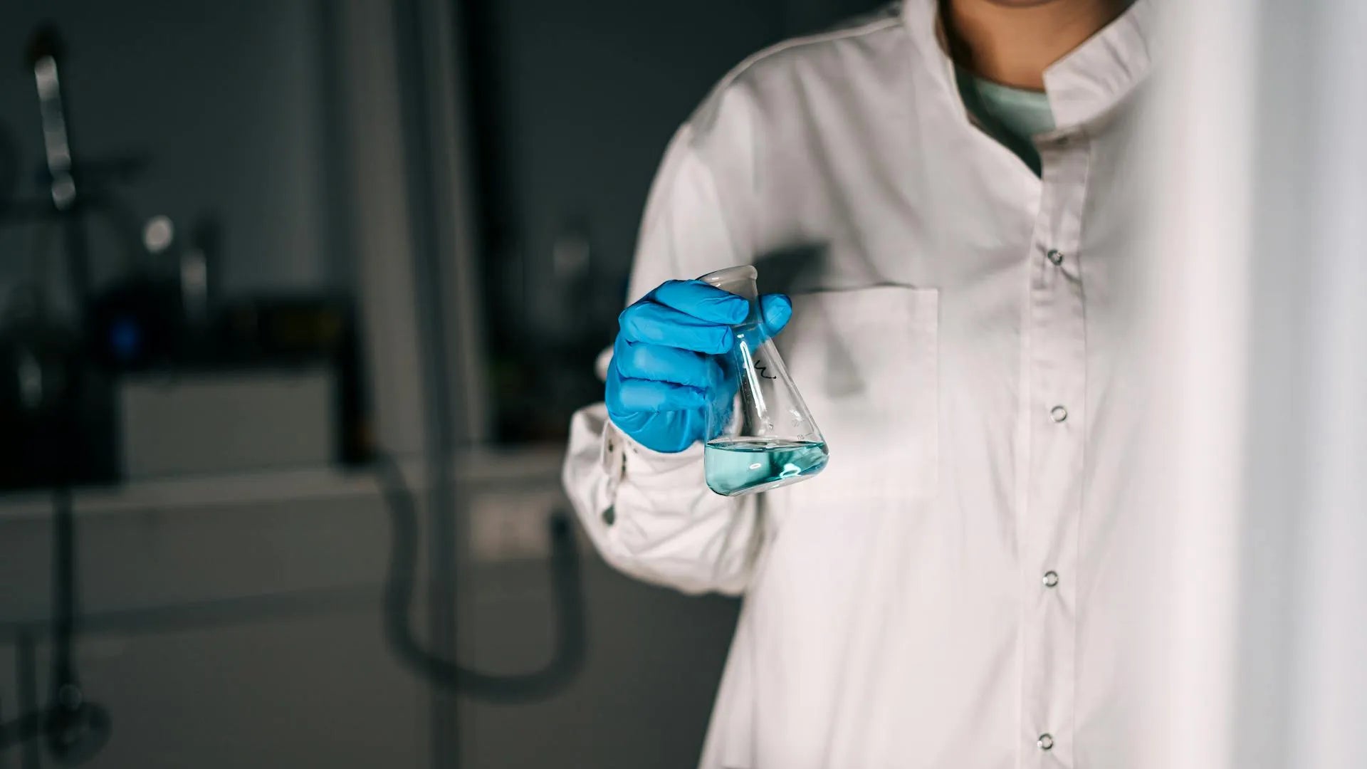 a person holding research tube