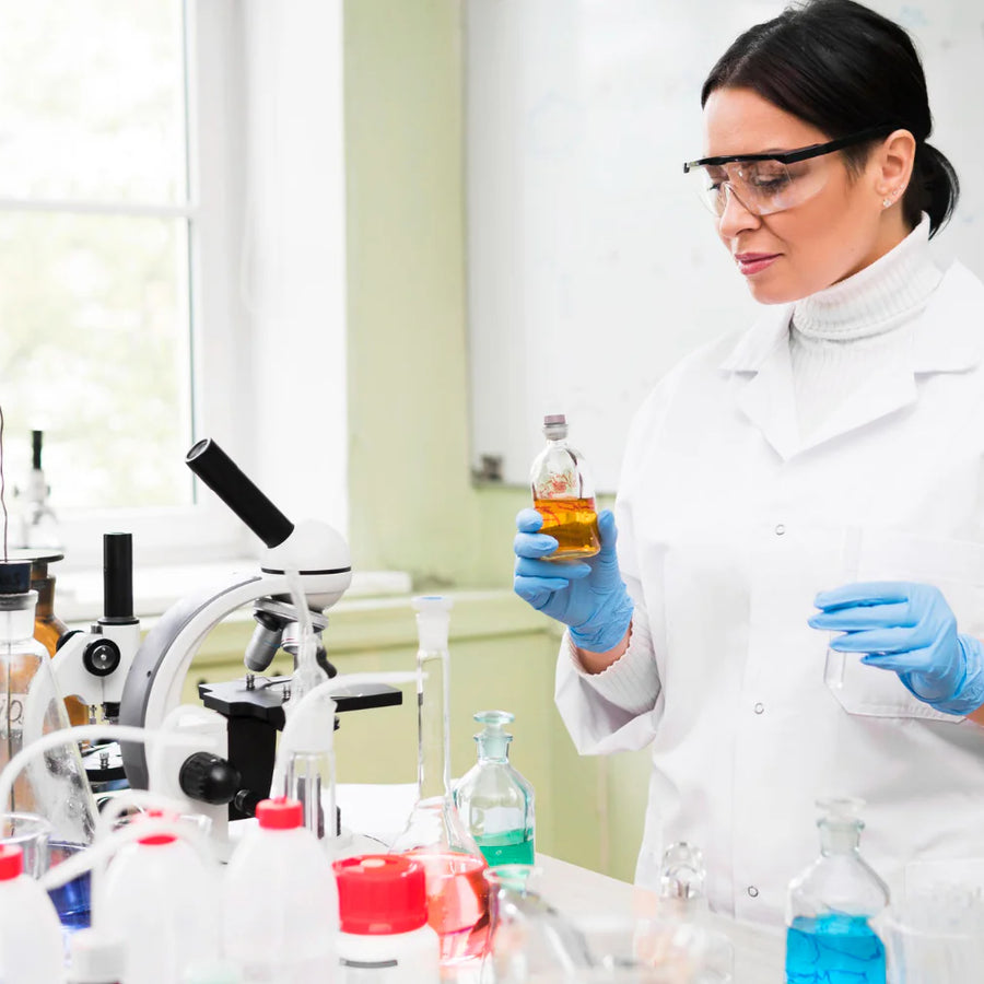 Scientist examining a liquid sample in a chemistry lab