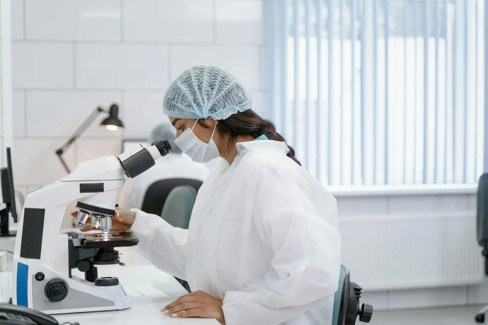 a woman with complete ppe conducting a research