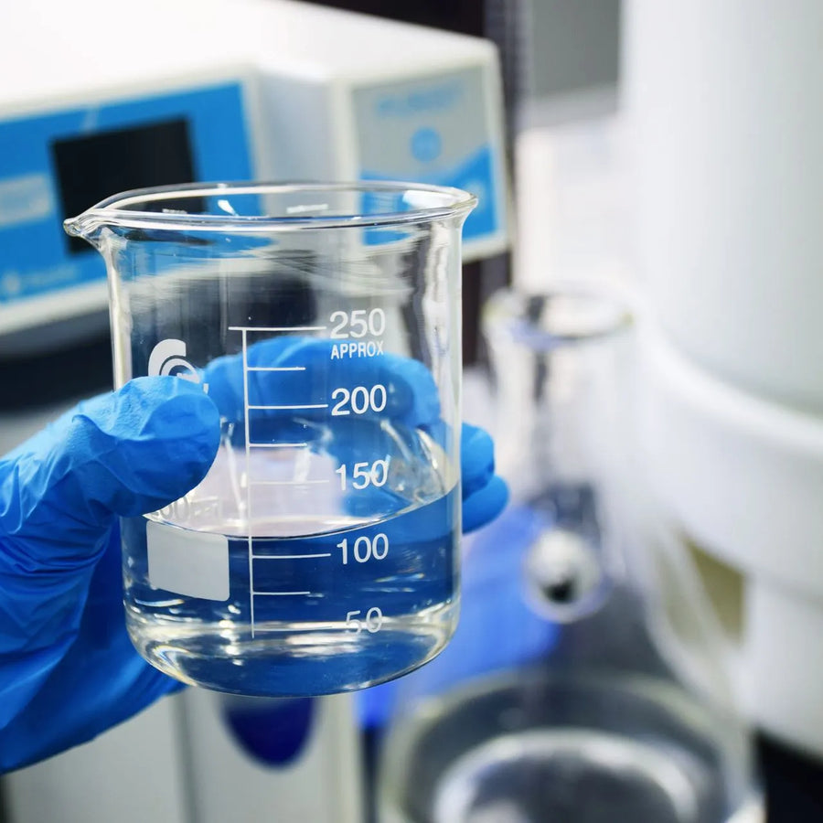 a person holding research cylinder