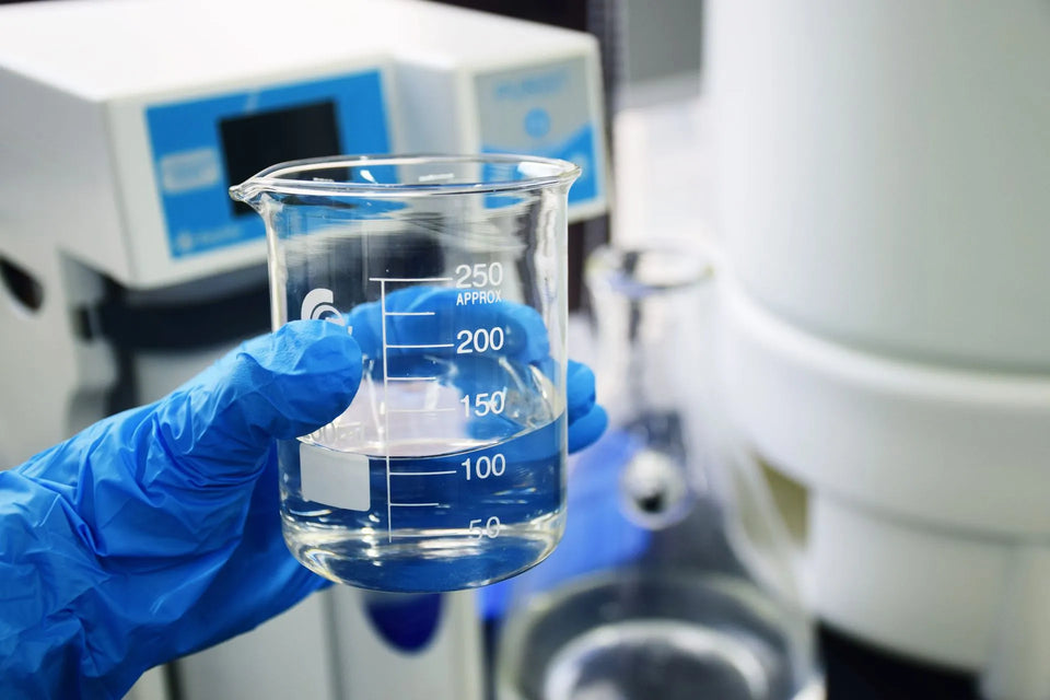 a person holding research cylinder