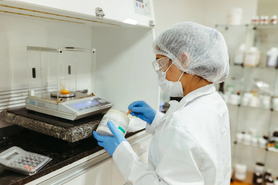 a woman conducting lab research on phenibut powder